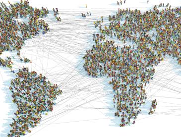 World map made up of people standing in the shape of the continents.